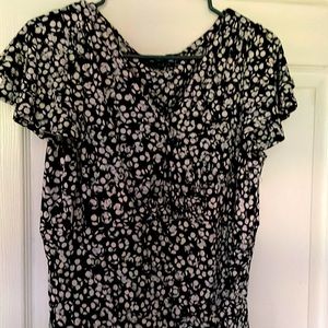 black and white dress draped under the knee